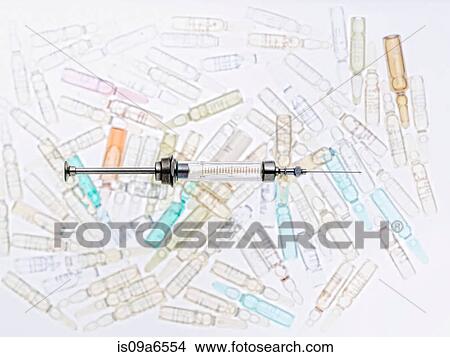 Picture - Close up of syringe and vials. Fotosearch