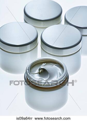 Stock Photography - Close up of white jar of lotion. Fotosearch