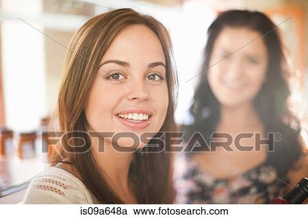 Stock Image - Close up of woman's smiling face. Fotosearch