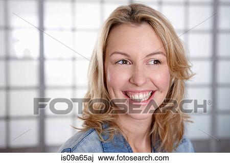 Stock Image - Close up of woman's smiling face. Fotosearch