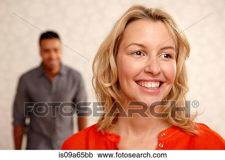 Stock Image - Close up of woman's smiling face. Fotosearch