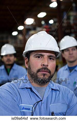 Stock Image - Close up of worker in metal plant. Fotosearch