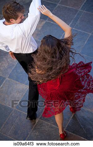 Stock Image - Couple dancing together outdoors. Fotosearch