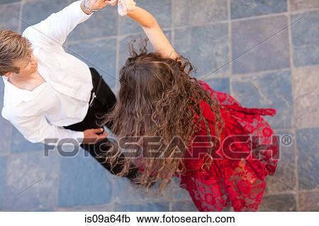 Stock Image - Couple dancing together outdoors. Fotosearch