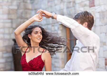 Couple dancing together outdoors View Large Photo Image Stock Image - Couple dancing together outdoors. Fotosearch