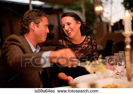 Couple having dinner in restaurant View Large Photo Image Stock Photograph - Couple having dinner in restaurant. Fotosearch