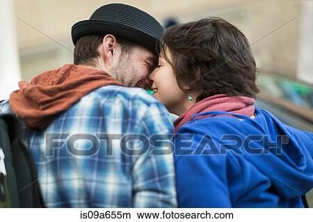 Couple kissing on escalator View Large Photo Image Picture - Couple kissing on escalator. Fotosearch