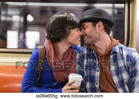 Couple kissing on urban subway View Large Photo Image Stock Image - Couple kissing on urban subway. Fotosearch