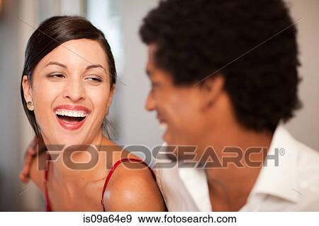Stock Photo - Couple laughing together. Fotosearch