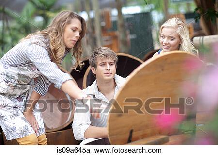 Stock Image - Couple shopping for planters. Fotosearch