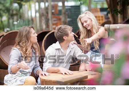 Stock Image - Couple shopping for planters. Fotosearch