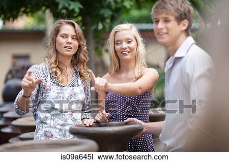 Stock Image - Couple shopping for planters. Fotosearch