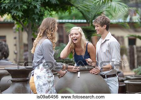 Stock Photograph - Couple shopping for planters. Fotosearch