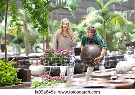 Couple shopping for planters View Large Photo Image Stock Photograph - Couple shopping for planters. Fotosearch