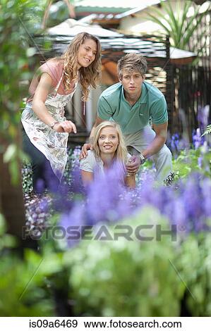 Couple shopping for plants in nursery View Large Photo Image Stock Photo - Couple shopping for plants in nursery. Fotosearch