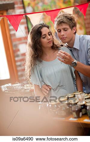 Stock Image - Couple shopping in grocery. Fotosearch