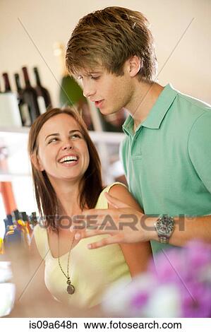 Couple shopping in grocery store View Large Photo Image Picture - Couple shopping in grocery store. Fotosearch