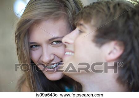 Picture - Couple smiling together outdoors. Fotosearch