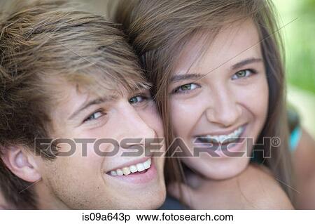 Stock Photography - Couple smiling together outdoors. Fotosearch