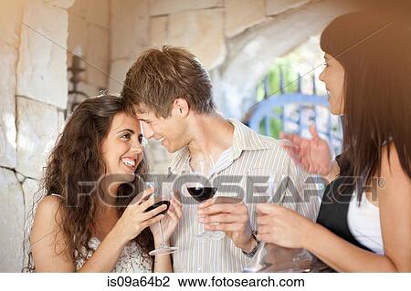 Couple tasting wine in doorway View Large Photo Image Stock Image - Couple tasting wine in doorway. Fotosearch