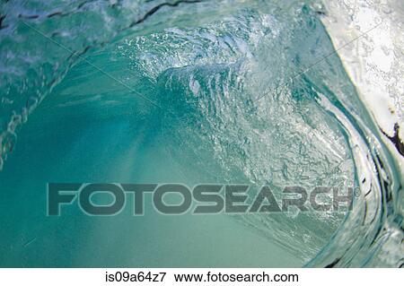 Stock Photo - Crashing wave viewed underwater. Fotosearch