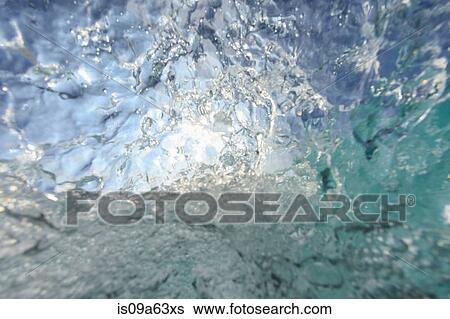Crashing wave viewed underwater View Large Photo Image Stock Photograph - Crashing wave viewed underwater. Fotosearch