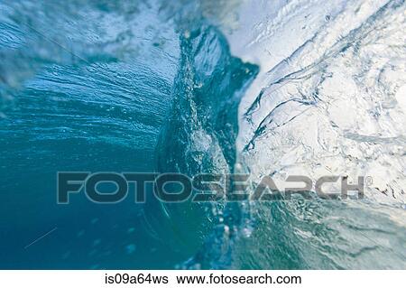 Stock Photograph - Crashing wave viewed underwater. Fotosearch