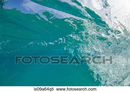 Stock Photography - Crashing wave viewed underwater. Fotosearch