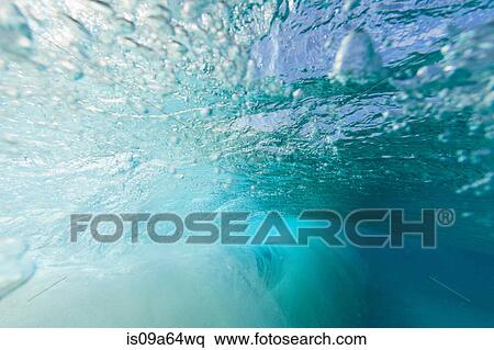 Stock Photography - Crashing wave viewed underwater. Fotosearch
