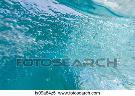 Stock Photography - Crashing wave viewed underwater. Fotosearch