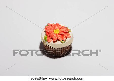 Cupcake decorated with flower View Large Photo Image Stock Photo - Cupcake decorated with flower. Fotosearch
