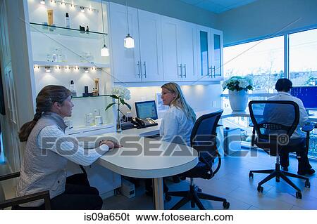 Doctor and patient talking in office View Large Photo Image Stock Photograph - Doctor and patient talking in office. Fotosearch