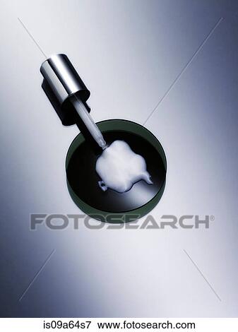 Dropper with lotion in petri dish View Large Photo Image Stock Photo - Dropper with lotion in petri dish. Fotosearch