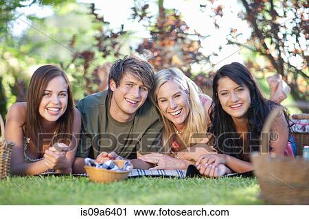 Family having picnic together View Large Photo Image Stock Image - Family having picnic together. Fotosearch