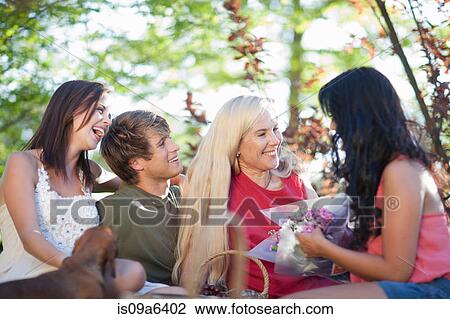 Family having picnic together View Large Photo Image Stock Image - Family having picnic together. Fotosearch