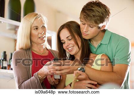 Stock Photography - Family shopping for vinegar. Fotosearch