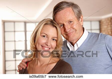 Stock Photo - Father and daughter smiling together. Fotosearch