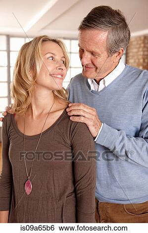 Stock Photograph - Father and daughter smiling together. Fotosearch