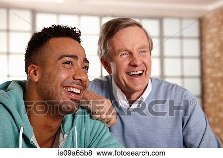 Stock Photo - Father and son smiling together. Fotosearch