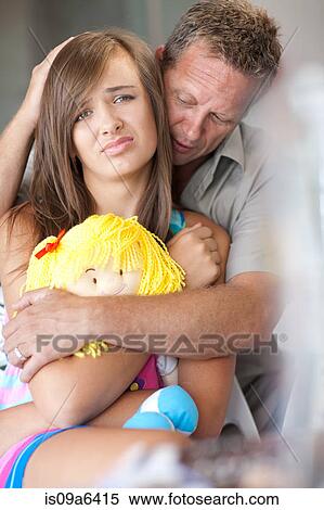 Father comforting teenage daughter View Large Photo Image Stock Photography - Father comforting teenage daughter. Fotosearch