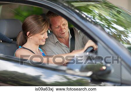 Father teaching teenage daughter driving View Large Photo Image Stock Image - Father teaching teenage daughter driving. Fotosearch