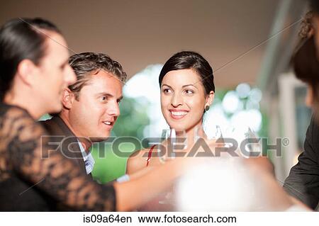 Friends toasting in restaurant View Large Photo Image Picture - Friends toasting in restaurant. Fotosearch