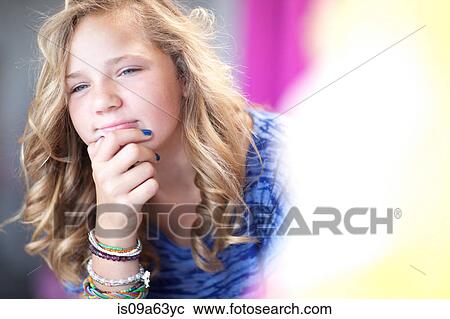Girl thinking with chin in hand View Large Photo Image Stock Image - Girl thinking with chin in hand. Fotosearch