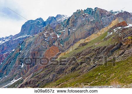 Grass growing on rocky mountainside View Large Photo Image Stock Photo - Grass growing on rocky mountainside. Fotosearch