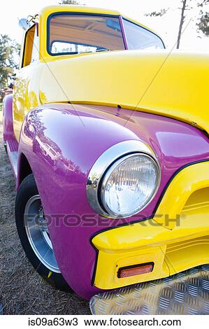 Stock Image - Headlight of colorful car. Fotosearch