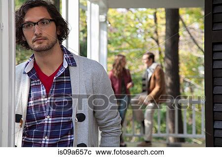 Man standing on porch View Large Photo Image Stock Image - Man standing on porch. Fotosearch
