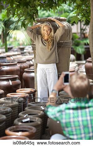 Man taking picture of girlfriend View Large Photo Image Stock Photography - Man taking picture of girlfriend. Fotosearch