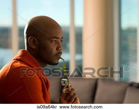Man with eyeglasses thinking View Large Photo Image Stock Photography - Man with eyeglasses thinking. Fotosearch