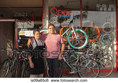 Mechanics outside in bicycle shop View Large Photo Image Stock Photograph - Mechanics outside in bicycle shop. Fotosearch
