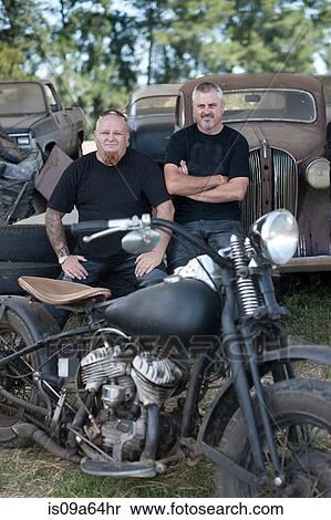 Men sitting with motorcycle View Large Photo Image Stock Photography - Men sitting with motorcycle. Fotosearch